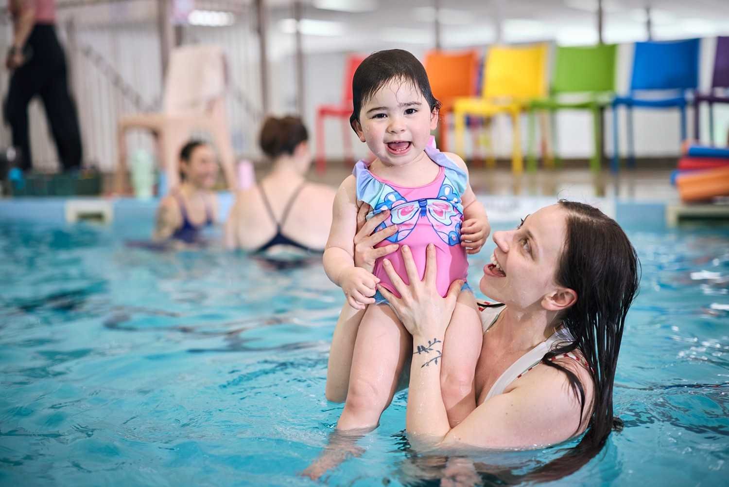 infant-swimming-lessons-parent-holding-baby